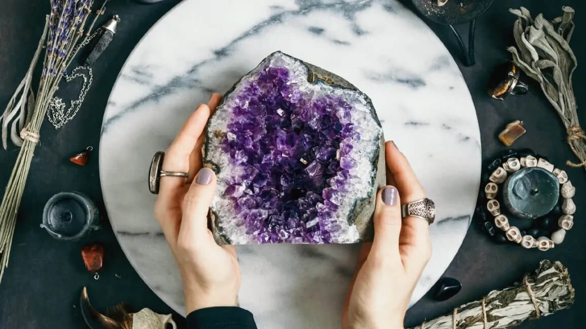 Holding Amethyst Stone 1296x728 Header